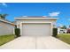 Detached single-car garage with a light-colored door at 11006 Silver Surfer Aly, Winter Garden, FL 34787