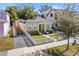 Quaint yellow house with a white picket fence and nicely landscaped yard at 123 N Hyer Ave, Orlando, FL 32801