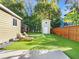 Artificial turf backyard with shed and wooden fence at 123 N Hyer Ave, Orlando, FL 32801