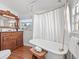 Elegant bathroom with antique vanity and clawfoot tub at 123 N Hyer Ave, Orlando, FL 32801