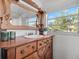 Bathroom with antique vanity and a window with natural light at 123 N Hyer Ave, Orlando, FL 32801