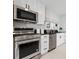 Stainless steel appliances and white shaker cabinets in kitchen at 123 N Hyer Ave, Orlando, FL 32801