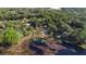 Aerial view of a property near a lake with lush vegetation at 1260 Lake Helen Osteen Rd, Lake Helen, FL 32744