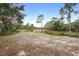 Open grassy area with pond view at 1260 Lake Helen Osteen Rd, Lake Helen, FL 32744