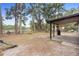 Backyard with covered patio, grill, and fenced area at 1260 Lake Helen Osteen Rd, Lake Helen, FL 32744