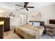 Main bedroom with a dresser and a large bed at 1260 Lake Helen Osteen Rd, Lake Helen, FL 32744