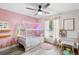 Light and airy bedroom with a whimsical house bed at 1260 Lake Helen Osteen Rd, Lake Helen, FL 32744