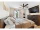 Relaxing main bedroom with large bed and wood dresser at 1260 Lake Helen Osteen Rd, Lake Helen, FL 32744