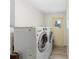 Laundry room with washer, dryer, and exterior access at 1260 Lake Helen Osteen Rd, Lake Helen, FL 32744