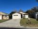 One-story house with attached garage and lawn at 138 Meadow Blvd, Sanford, FL 32771