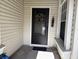 Black front door with sunflower wreath and small bench at 138 Meadow Blvd, Sanford, FL 32771