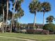 Relaxing pool area with shaded seating and tropical landscaping at 138 Meadow Blvd, Sanford, FL 32771