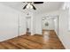 Well-lit bedroom with wood-look floors and mirrored closet at 1413 Evangeline Ave, Orlando, FL 32809