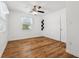 Spacious bedroom with wood-look floors and ceiling fan at 1413 Evangeline Ave, Orlando, FL 32809