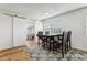 Dining area with wood floors, barn door, and dark wood table at 1413 Evangeline Ave, Orlando, FL 32809