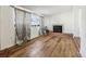 Living room with wood-look floors, fireplace, and neutral walls at 1413 Evangeline Ave, Orlando, FL 32809