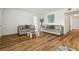 Bright living room with hardwood floors and comfy sofas at 1413 Evangeline Ave, Orlando, FL 32809