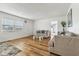 Bright living room with hardwood floors and comfy sofas at 1413 Evangeline Ave, Orlando, FL 32809