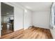 Bright spare bedroom with wood flooring and neutral walls at 1413 Evangeline Ave, Orlando, FL 32809