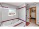 Bathroom with a jetted tub, shower, and linen closet at 1432 Libby Rd, Babson Park, FL 33827