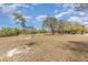 Open land with mature trees and sparse vegetation at 1432 Libby Rd, Babson Park, FL 33827