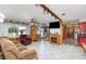 Living room with fireplace, tiled floors, and comfy seating at 1432 Libby Rd, Babson Park, FL 33827