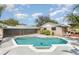 Inviting kidney-shaped pool with a spa at 1432 Libby Rd, Babson Park, FL 33827