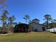 Nice backyard with a screened-in pool and patio at 1490 11Th Ave, Deland, FL 32724