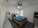 Bedroom with a bed featuring a gray frame and gray bedding, plus ceiling fan and natural light at 1490 11Th Ave, Deland, FL 32724