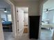 Hallway with doors to bedrooms and a bathroom at 1490 11Th Ave, Deland, FL 32724