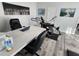 Home office with modern desk and exercise equipment at 15783 Tangerine Dream Ct, Winter Garden, FL 34787