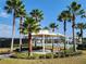 Park pavilion with benches, landscaping, and palm trees, perfect for relaxation at 15783 Tangerine Dream Ct, Winter Garden, FL 34787