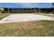 Outdoor sand volleyball court with net, surrounded by green grass at 15783 Tangerine Dream Ct, Winter Garden, FL 34787