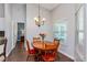 Bright dining room with wooden table and chairs, near the kitchen at 1715 Concert Rd, Deltona, FL 32738