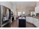 Spacious kitchen featuring stainless steel appliances and granite countertops at 1715 Concert Rd, Deltona, FL 32738