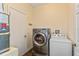 Laundry room with washer, dryer and storage at 1715 Concert Rd, Deltona, FL 32738