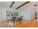 Dining room with hardwood floors, exposed beams, and a large window at 1819 Paloma Ave, Sanford, FL 32771