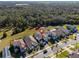 Aerial view of a house with a pool and a surrounding community at 1861 Goblet Cove St, Kissimmee, FL 34746