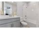 Clean bathroom with single vanity, shower, and bathtub at 1861 Goblet Cove St, Kissimmee, FL 34746