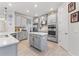 Modern kitchen with gray cabinets, quartz counters, and island at 1861 Goblet Cove St, Kissimmee, FL 34746