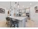 Modern kitchen with gray cabinetry, quartz countertops, and island at 1861 Goblet Cove St, Kissimmee, FL 34746