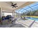 Covered lanai with seating area and pool access at 1861 Goblet Cove St, Kissimmee, FL 34746