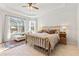 Relaxing main bedroom with a large brass bed and plenty of natural light at 1861 Goblet Cove St, Kissimmee, FL 34746