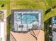 Aerial view of a screened-in pool and spa at 1861 Goblet Cove St, Kissimmee, FL 34746