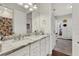 Elegant bathroom with double vanity and marble countertop at 1954 Filly Trl, Oviedo, FL 32765