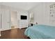 Bright bedroom with wood floors, dresser, and polka dot bedding at 1954 Filly Trl, Oviedo, FL 32765