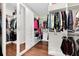 Walk-in closet with ample hanging space and drawers at 1954 Filly Trl, Oviedo, FL 32765