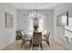 Elegant dining room featuring a glass-top table and chandelier at 1954 Filly Trl, Oviedo, FL 32765