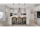 Modern kitchen with white cabinets, stainless steel appliances, and an island at 1954 Filly Trl, Oviedo, FL 32765