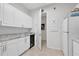 Laundry room with cabinets and wine cooler at 1954 Filly Trl, Oviedo, FL 32765